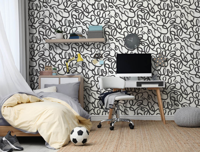 black and white wallpaper on a teen bedroom wall